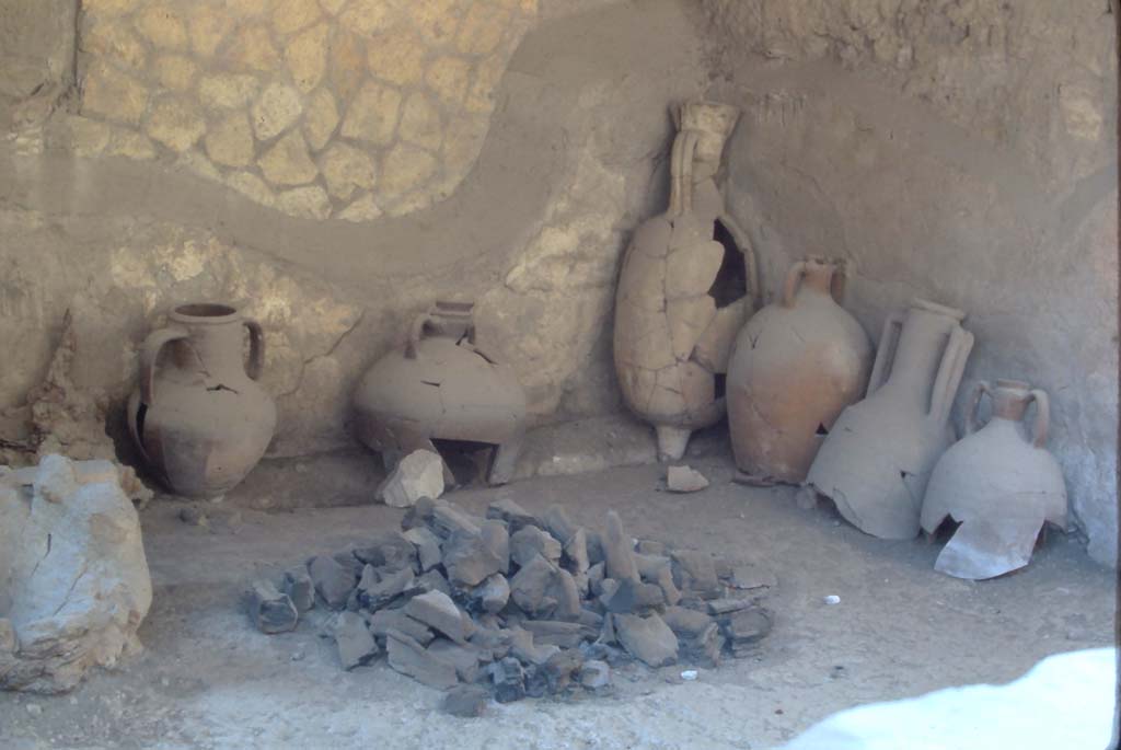 VI.12 Herculaneum, 4th December 1971. Looking towards south wall of shop-room, with collection of pots/amphorae, etc.
Photo courtesy of Rick Bauer, from Dr George Fay’s slides collection.
